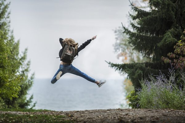 the newlife portal by kevin wallace woman jumping in forest